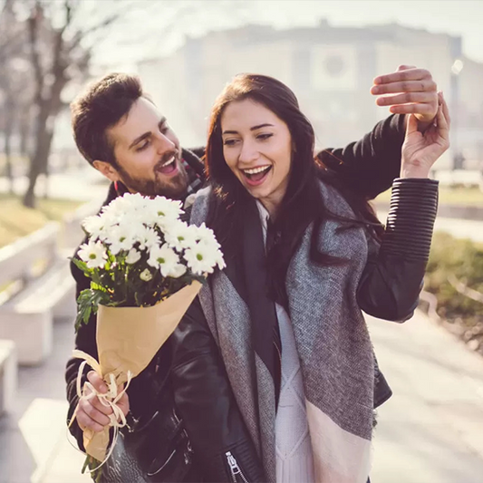 Man Giving a Woman Flowers