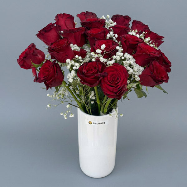 Twenty red China roses with gypsophila baby's breath arranged in a white glass vase, a grand romantic gesture with same-day Metro Manila flower delivery