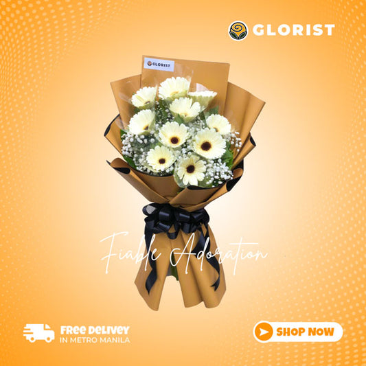 Stunning floral arrangement featuring 10 white gerberas, adorned with gypsophila fillers in a two toned Korean wrap tied in black satin ribbon. Enhanced with satin ribbon for an elegant touch. Perfect for weddings, special occasions, and gifts.