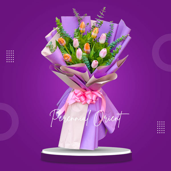 Bright bouquet: 5 orange and 5 pink tulips with Eucalyptus fillers in a Korean wrap, elegantly tied with a satin ribbon. A burst of color and beauty.