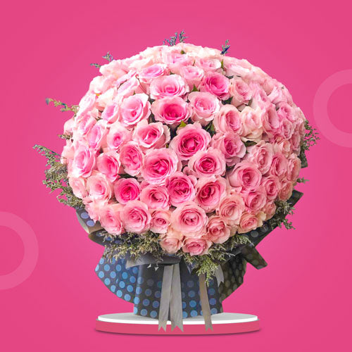 Centennial Dreamland Flower Bouquet featuring 100 light pink Ecuadorian roses, symbolizing love, tenderness, and admiration, crafted into a breathtaking arrangement.