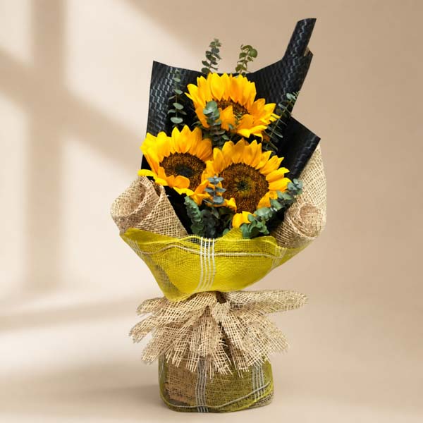 Summer Mint bouquet featuring 3 sunflowers with eucalyptus leaves, exuding warmth and freshness.