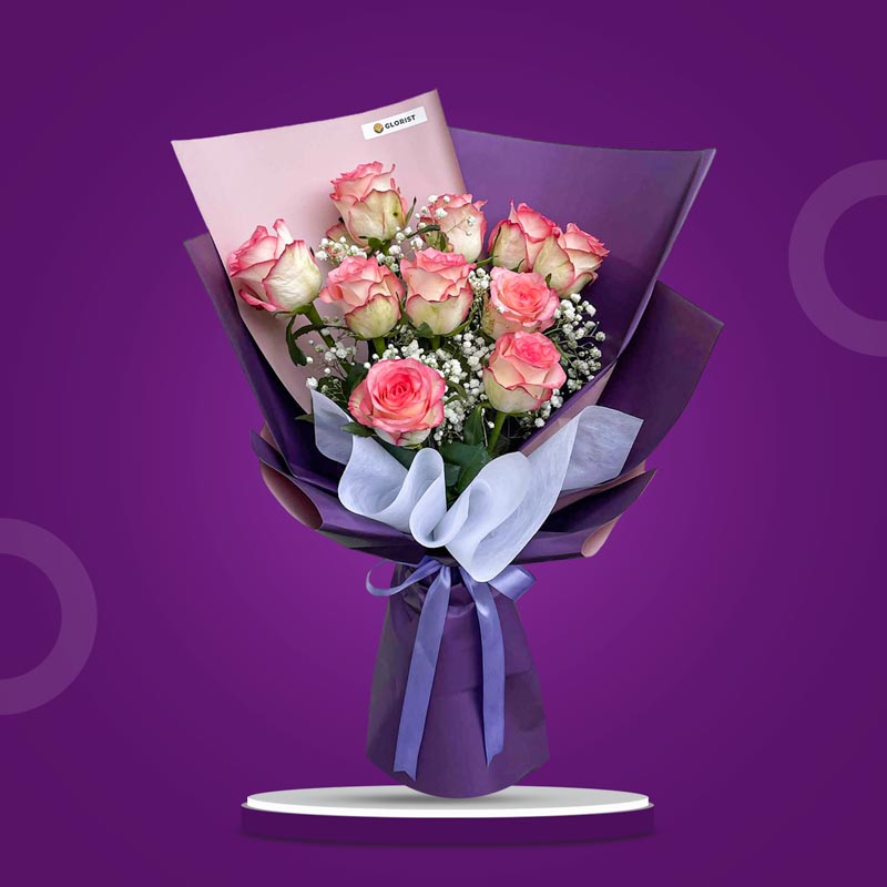 Affectionate Flora bouquet with 2‑toned light pink China roses and gypsophila baby’s breath in purple Korean wrap tied with a lavender ribbon