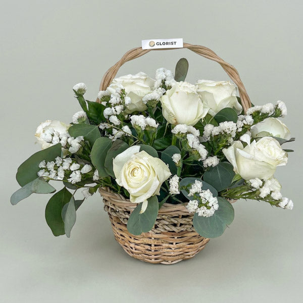 Celeste Fantasy Flower Basket with white China roses, eucalyptus silver dollar, and white statice in a handwoven basket, same-day delivery in Metro Manila