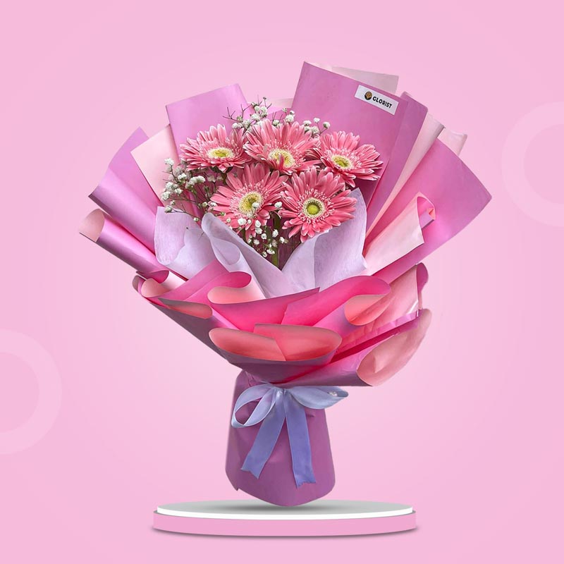 Charming Adoration bouquet featuring 5 light pink gerbera daisies with gypsophila baby’s breath