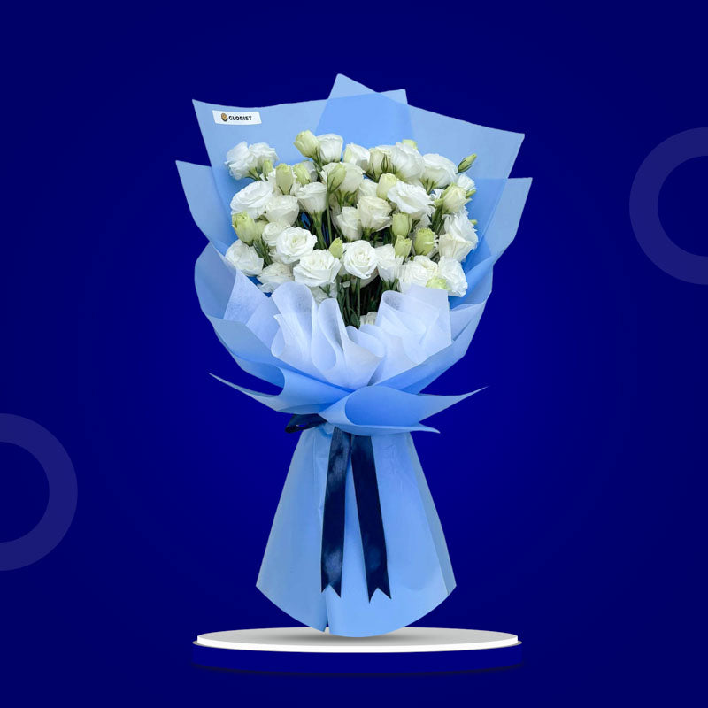 Crimson Fields bouquet with white lisianthus paper roses wrapped in light blue Korean paper and white non-woven, tied with a navy blue ribbon