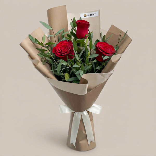 Famous Flora bouquet with 3 red China roses and eucalyptus parvifolia in café Korean wrap with latte ribbon