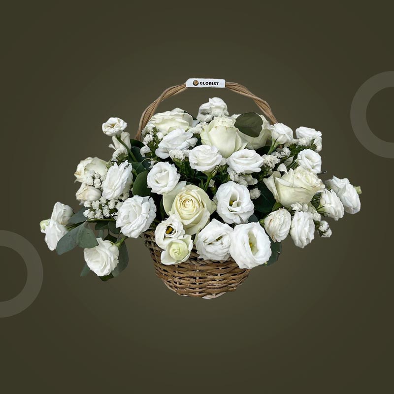 Gleam Fantasy basket with white China roses, lisianthus, white statice, and silver dollar eucalyptus in a wicker basket