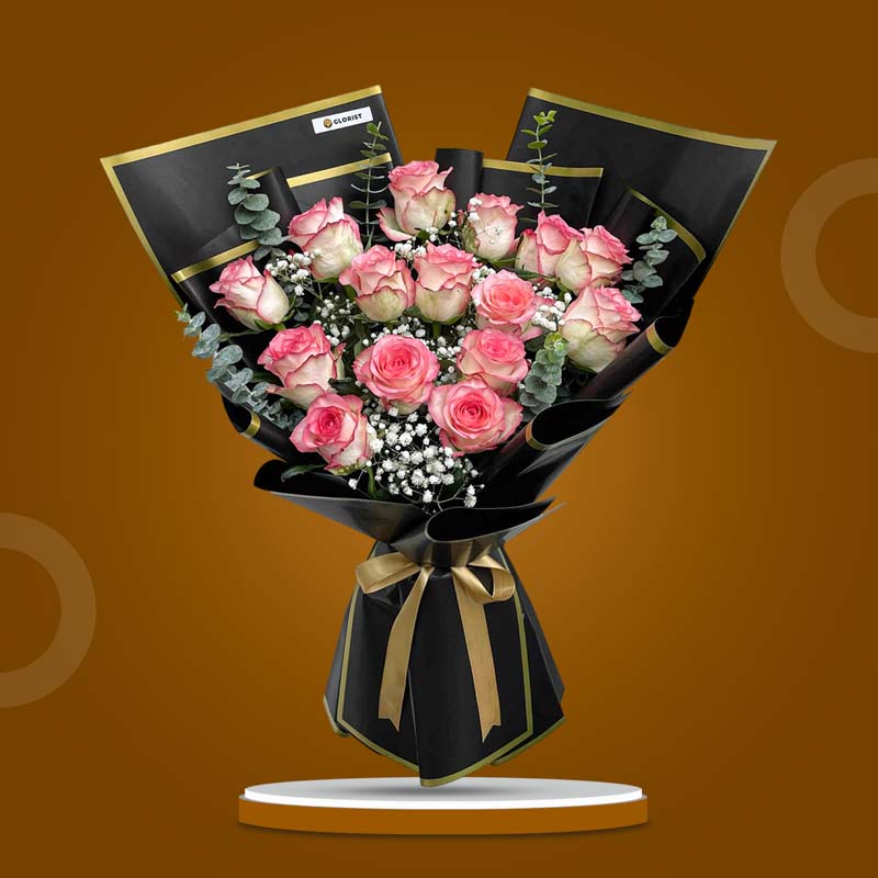 Hope Flora bouquet with 2‑toned light pink China roses, gypsophila baby’s breath, and eucalyptus baby blue in black‑bordered wrap tied with a light gold ribbon