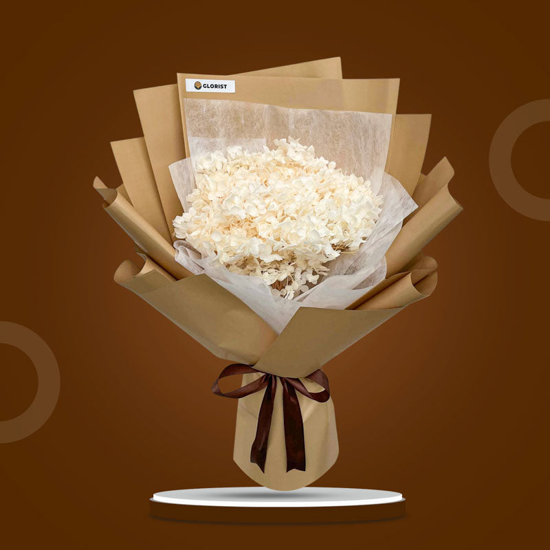 Jade Timeless dried bouquet with cream hydrangea in kraft and white non-woven wrap tied with brown ribbon