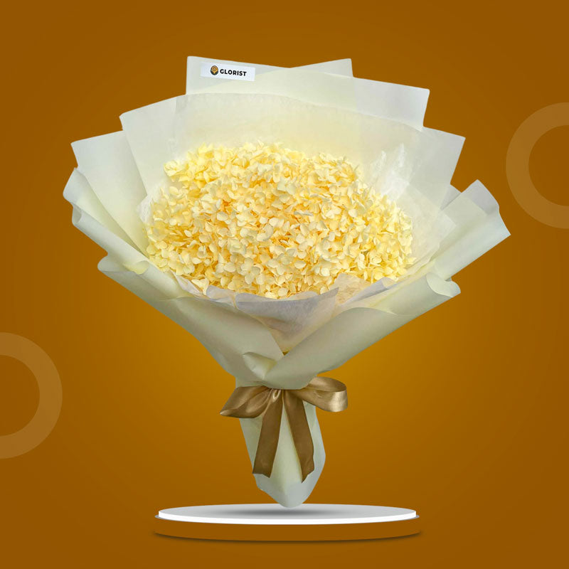 Lemon Timeless dried bouquet with light yellow hydrangea in light yellow Korean wrap and white non-woven, tied with light gold ribbon