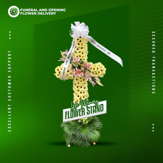 Life Memory Cross Stand with yellow gerbera daisies, stargazer lilies, and anahaw leaves