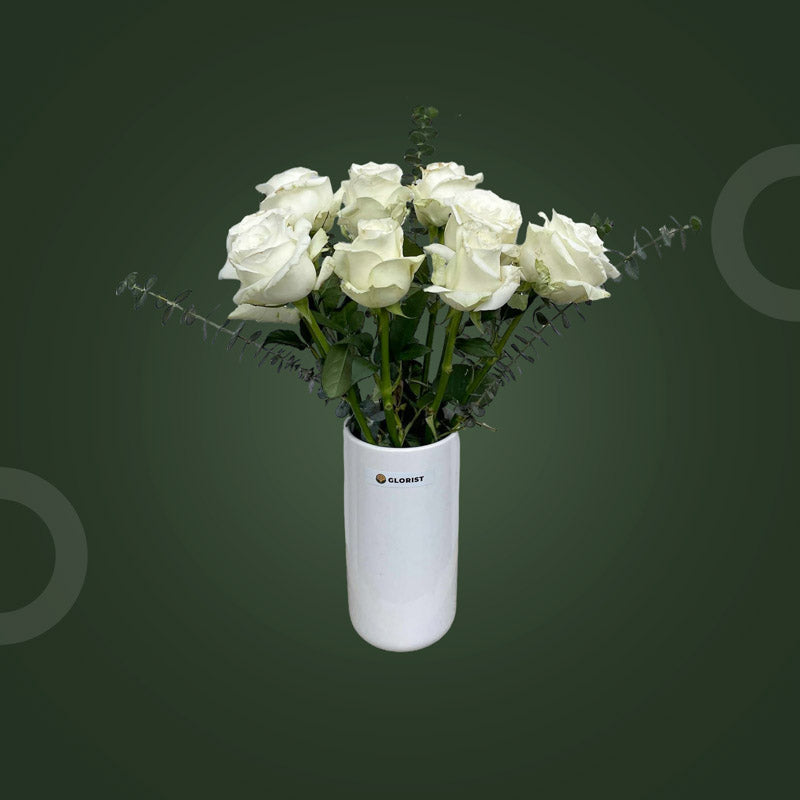 Loyal Fresh Flower Vase with ten white China roses and eucalyptus baby blue in a clear glass vase