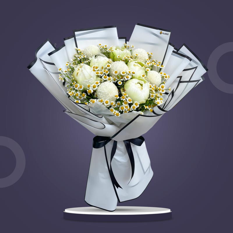 Lumen Fusion bouquet with white peonies, white pompoms, and egg asters wrapped in white Korean paper with black border and black ribbon