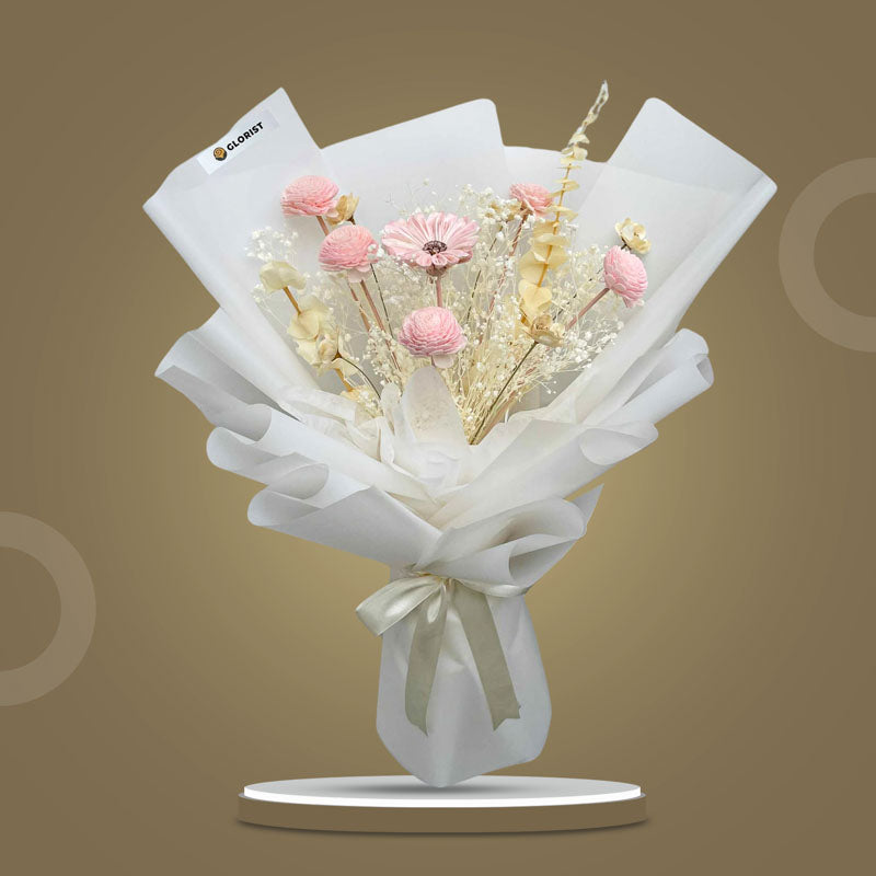 Moonstone Timeless dried bouquet with bleached gypsophila, primrose bundles, gerbera wooden, mini sola chrysanthemum, and bleached eucalyptus in white wrap with cream ribbon