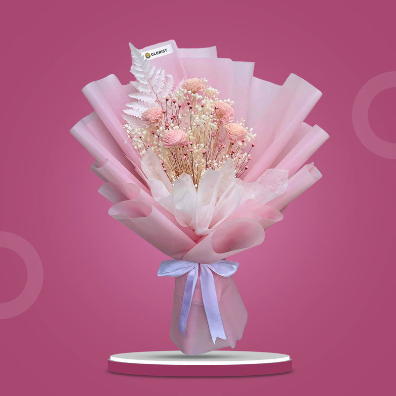 Morganite Timeless dried bouquet with 5 mini sola chrysanthemum, tiny star fillers (white & light pink), and white fern in light pink and white wrap with white ribbon