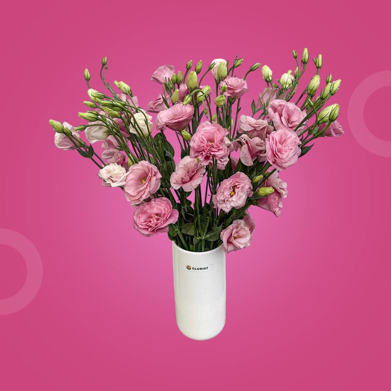 Nova Fresh Flower Vase with a bundle of lisianthus paper roses in a clear glass vase