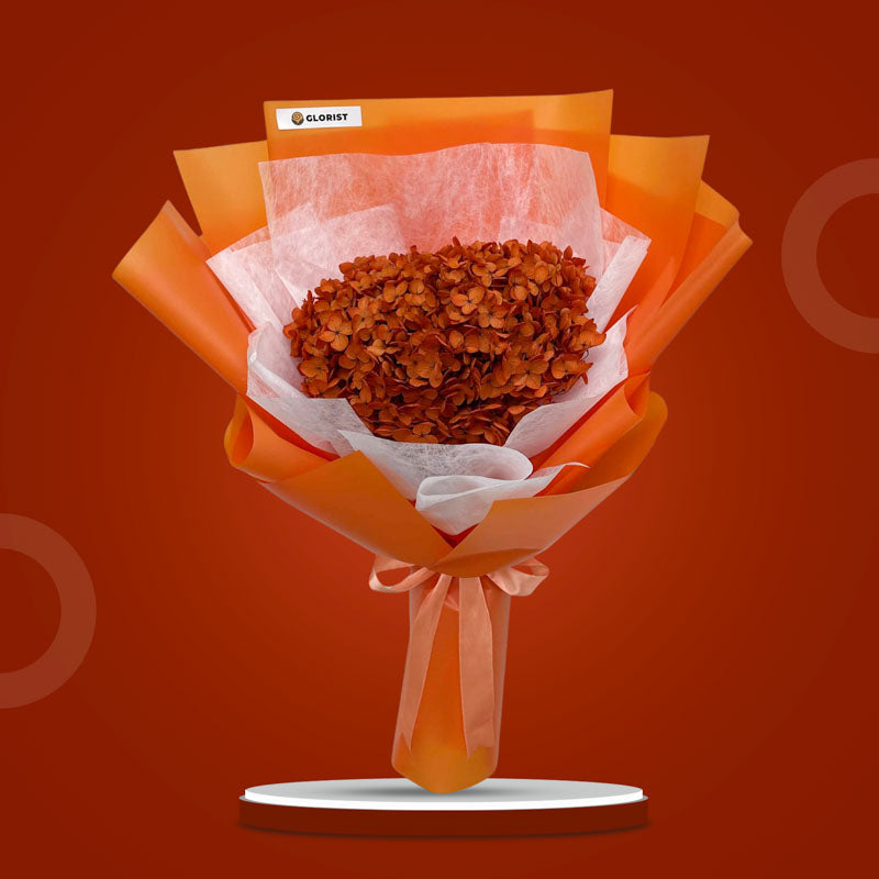 Opal Timeless dried bouquet with orange hydrangea in orange Korean wrap and white non-woven, tied with salmon ribbon