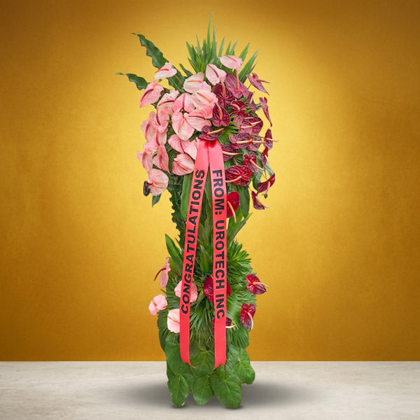 Optimistic Launch Inaugural Stand with pink and red anthurium and anahaw leaves for grand opening celebrations