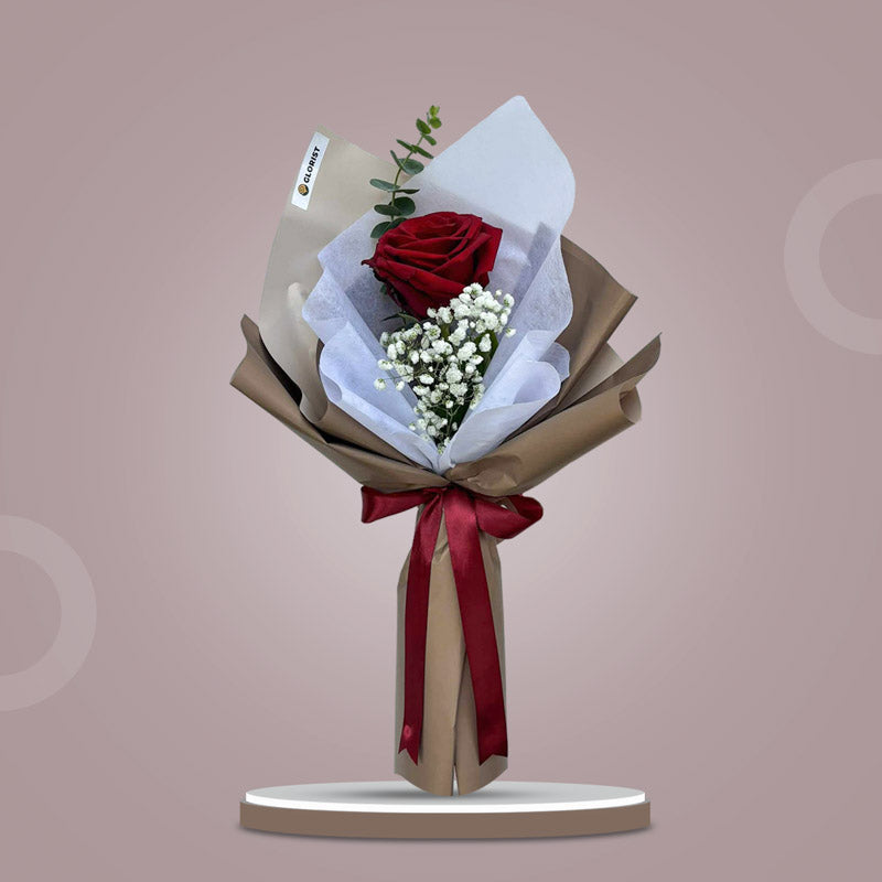 Pleasant Dreamland bouquet with red Ecuadorian rose, baby’s breath and eucalyptus wrapped in café-toned paper with maroon ribbon for Metro Manila delivery