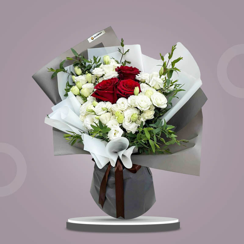 Premium Love bouquet with red Ecuadorian roses, white lisianthus, eucalyptus parvi in white and dark gray Korean wrap with brown ribbon