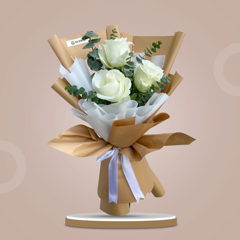 Purity Flora bouquet with 3 white China roses and eucalyptus baby blue in kraft Korean wrap and white non‑woven wrap with white ribbon