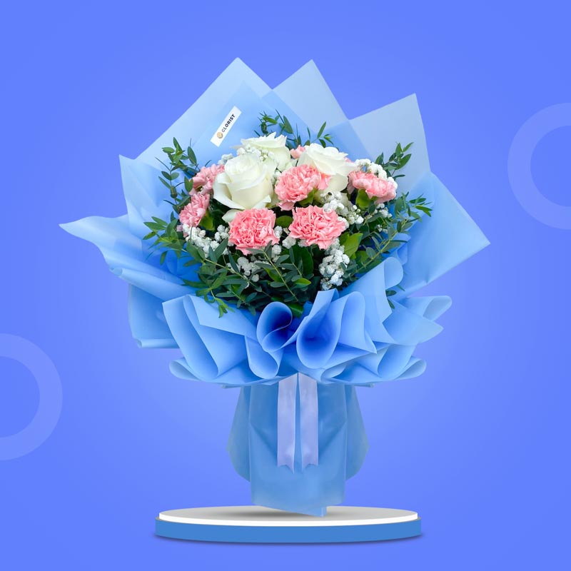 Quartz Love bouquet with white china roses, pink carnations, baby’s breath, and eucalyptus wrapped in light blue