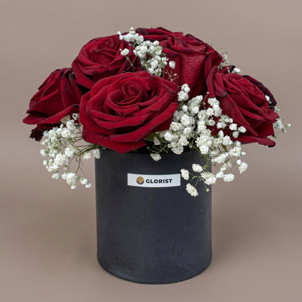 Twelve red Ecuadorian roses with white gypsophila baby's breath in a premium matte gift box, elegant anniversary and Valentine's Day flower gift with same-day Metro Manila delivery