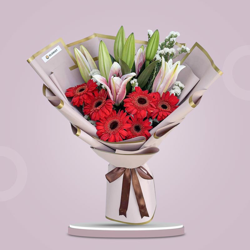 Refined Love bouquet with stargazers, gerberas, white statice wrapped in dirty pink Korean wrap with brown ribbon