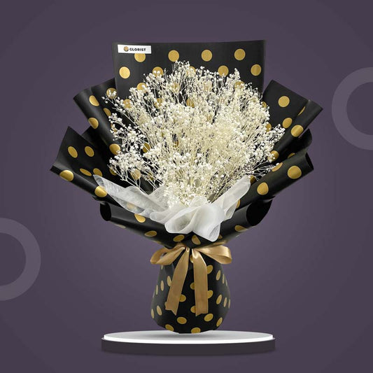 Rhodium Timeless dried bouquet with bleached gypsophila in black-gold polka Korean wrap and white non-woven, tied with light gold ribbon