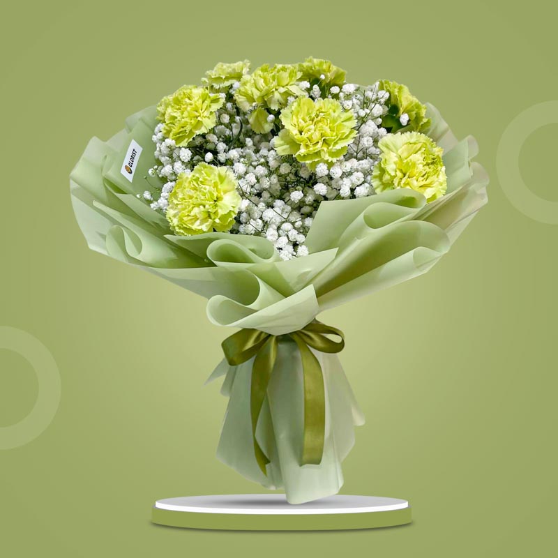Sacred Radiance bouquet with green carnations and gypsophila baby’s breath in green wrap with olive ribbon — same-day delivery Manila