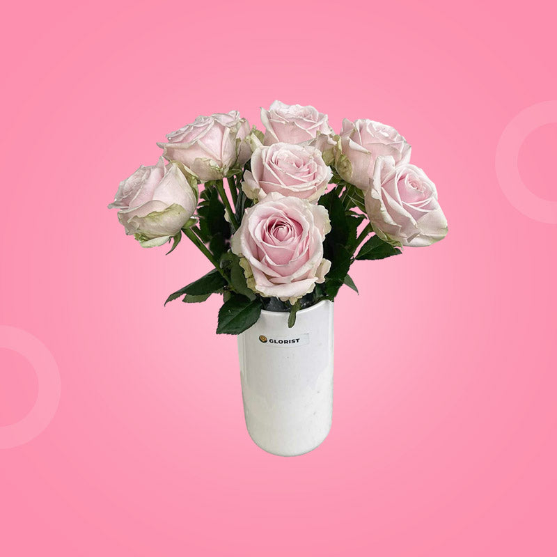 Secure Fresh Flower Vase with ten light pink China roses in a clear glass vase