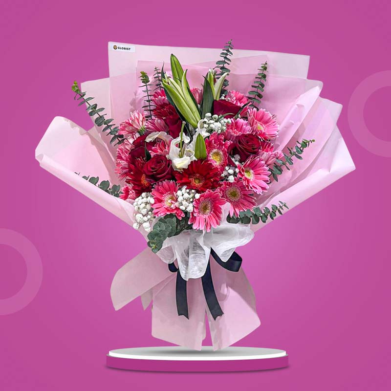 Serenity Love bouquet with pink and red carnations, red roses, white stargazer lily, gypsophila and eucalyptus — same-day delivery Manila