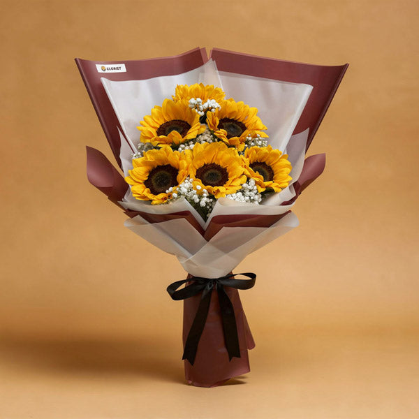 Steadfast Summer Flower Bouquet with six sunflowers and white baby’s breath wrapped in maroon and white Korean wrap with a black ribbon