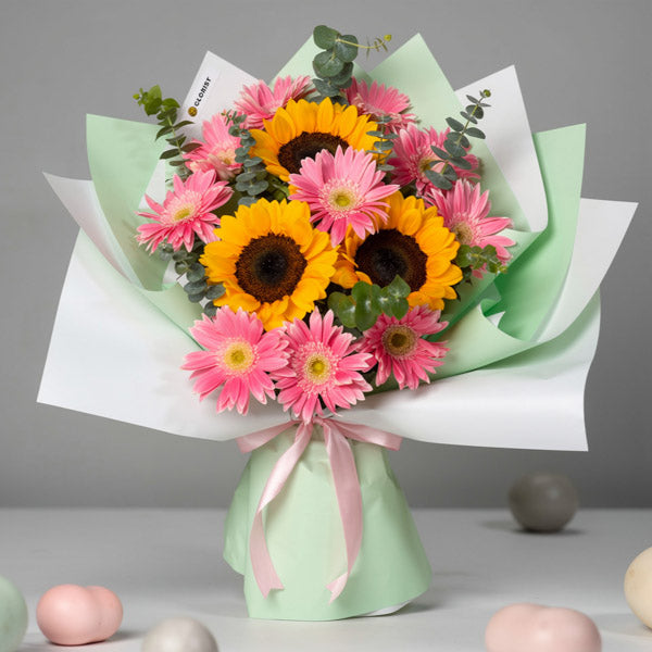 Sunflower and pink gerbera bouquet with eucalyptus and Korean-style wrapping