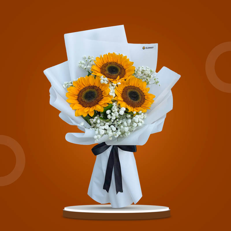 Sunny Embrace bouquet with three sunflowers and gypsophila in white Korean wrap tied with black ribbon