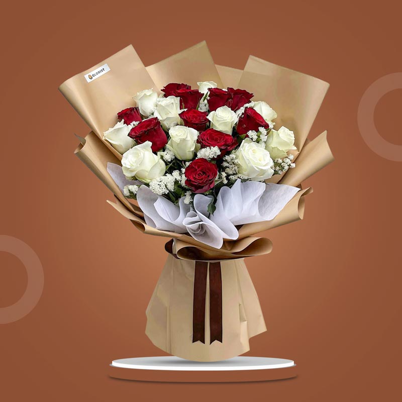 Swift Flora bouquet with 10 red China roses, 10 white China roses, and white statice in kraft and white wrap with brown ribbon