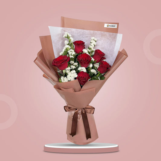 Tender Flora bouquet with 6 red China roses and white statice in bean brown and white wrap with brown ribbon