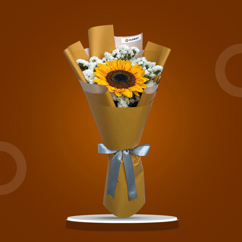 Upbeat Summer bouquet with sunflower and statice in mustard yellow Korean wrap and silver ribbon