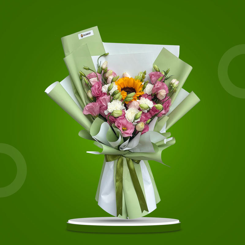 Warm Love bouquet with lisianthus paper roses, sunflower, and white carnations in matcha Korean wrap and dark olive ribbon