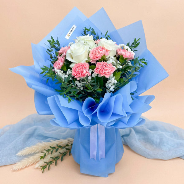 White rose and pink carnation bouquet with baby’s breath and eucalyptus fillers