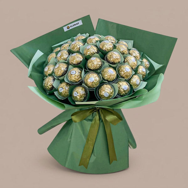 Wholesome Sweets Chocolate Bouquet with 48 Ferrero Rocher chocolates wrapped in matcha green Korean-style wrap and dark olive ribbon, same-day delivery in Metro Manila