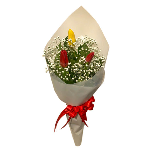 Sunny bouquet: yellow tulip and 2 red tulips with gypsophila fillers. Korean wrap with satin ribbon, a charming blend of colors and textures.