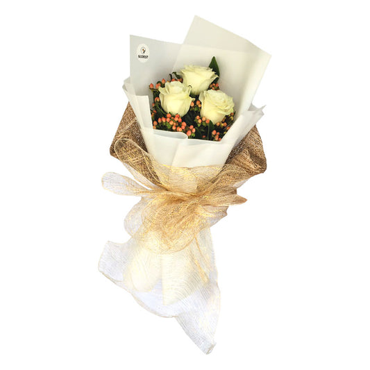 Timeless Elegance: A bouquet of three pristine white Ecuadorian roses accompanied by vibrant hypericum berries. The bouquet is expertly wrapped in a unique combination of Korean-style and burlap packaging, creating a visually captivating contrast. This arrangement exudes elegance and sophistication, making it an ideal choice for any special occasion or celebration.