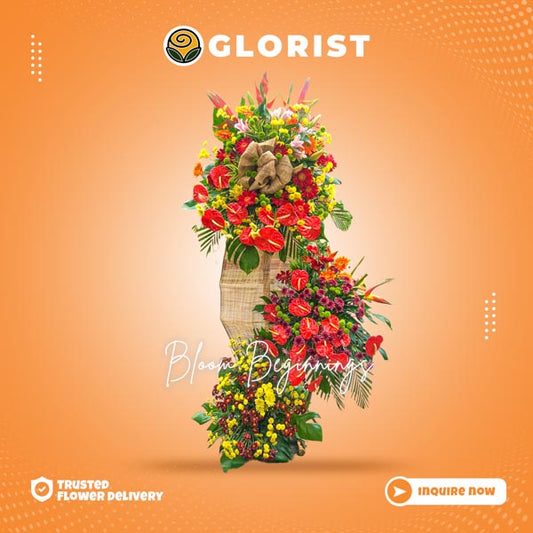 Inaugural Flower Stand: Red anthurium, red and orange gerbera daisies, stargazer, bird-of-paradise, green and yellow buttons - Vibrant and elegant floral arrangement.