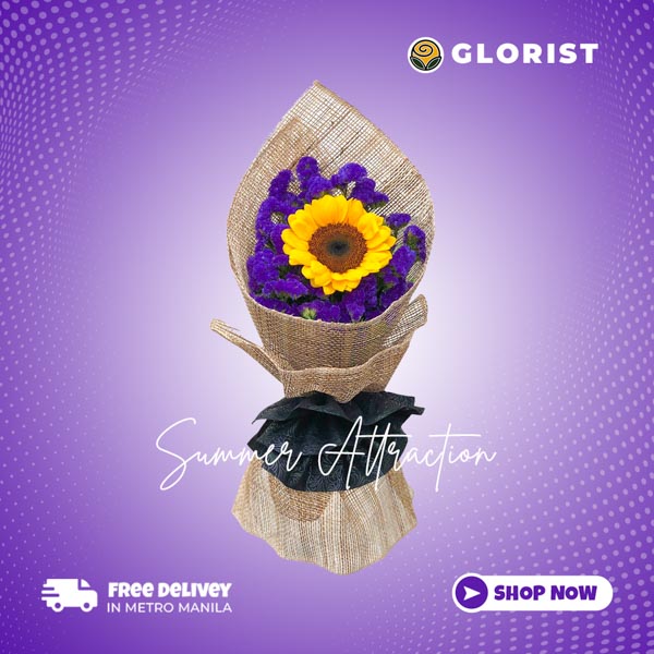 Summer Attraction: A captivating arrangement featuring a single sunflower accompanied by beautiful violet statice, elegantly wrapped in rustic burlap and tied with a delicate black tissue ribbon, evoking the charm of summer.