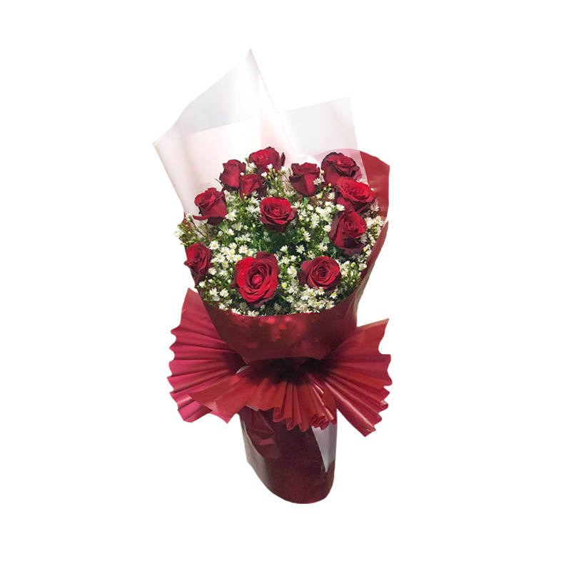 Country Dreams Bouquet: Capture the essence of pure romance with a dozen exquisite red Baguio roses and delicate aster, wrapped in maroon and white Korean film. A charming bouquet that evokes a sense of rustic beauty.