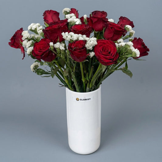 Fifteen red China roses with white statice in a white glass vase, an elegant anniversary and corporate gift with same-day Metro Manila delivery