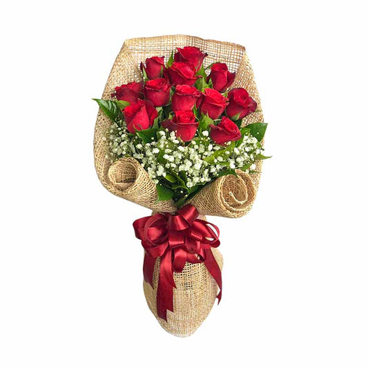 Classic Dreams: Timeless arrangement of 12 red roses with rosal and delicate gypsophila, evoking elegance and beauty. Perfect for any occasion. Flower delivery in Trece Martires, Cavite.