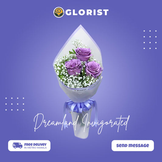A bouquet of three floral painted purple Ecuadorian roses accompanied by vibrant gypsophila. The bouquet is expertly wrapped in a unique combination of Korean-style and burlap packaging, creating a visually captivating contrast. This arrangement exudes elegance and sophistication, making it an ideal choice for any special occasion or celebration.